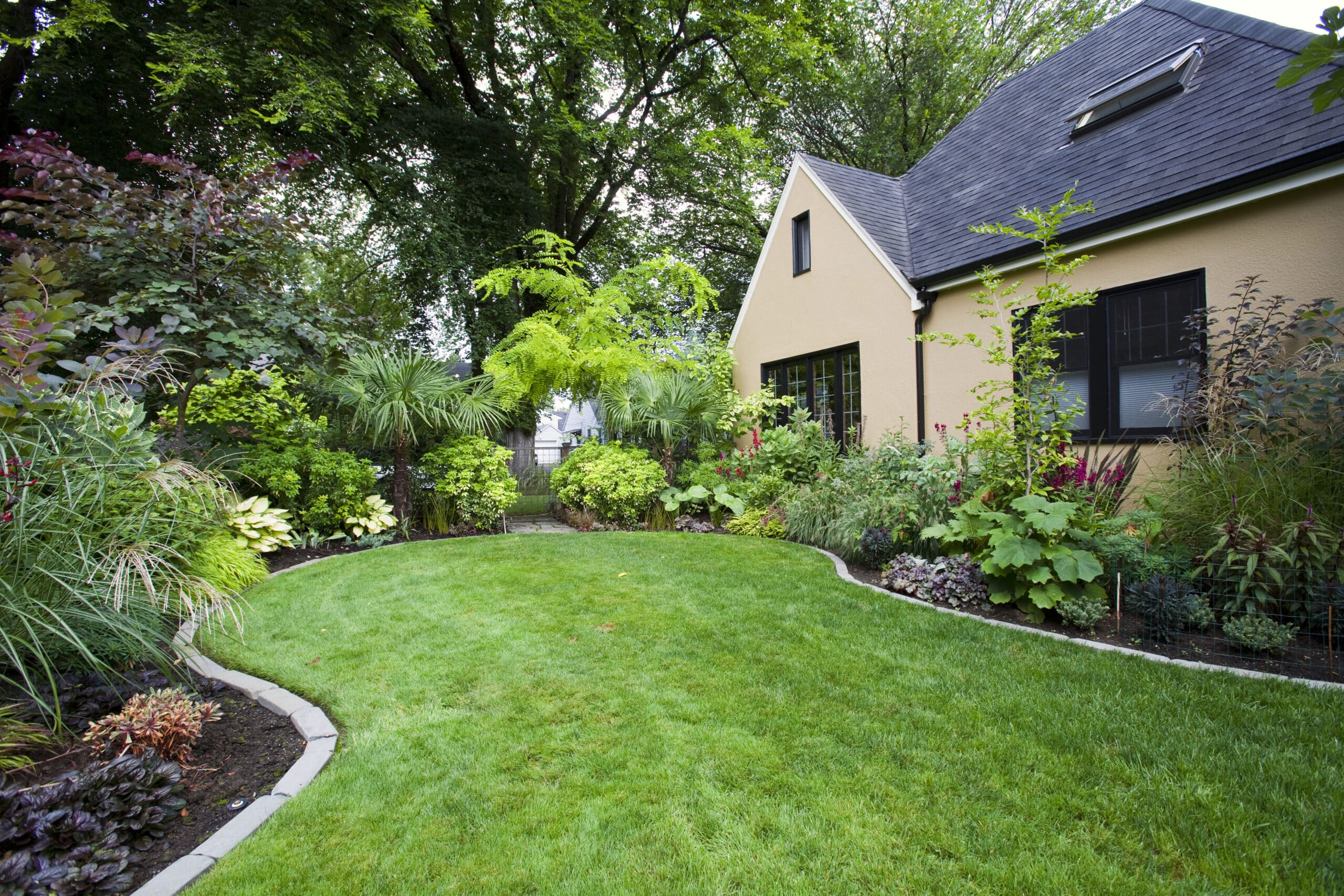 Our services 20 | Superior Service Pros house with a small landscaped space.jpg scaled