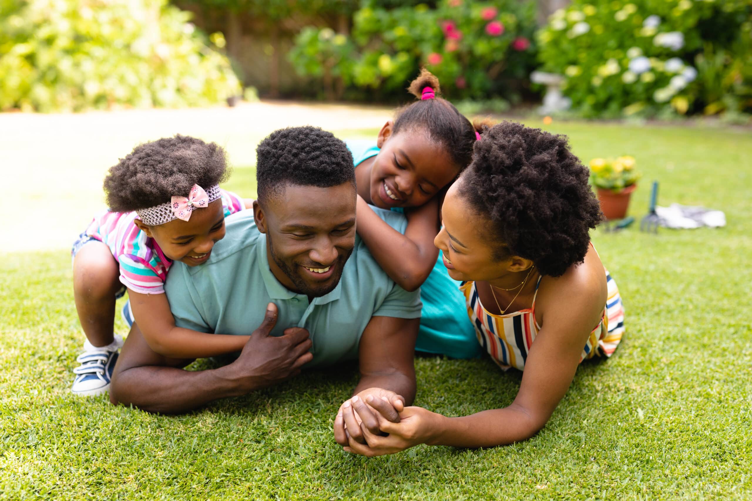 Fertilization 6 | happy african american family lying on grass at ba 2022 01 31 18 38 17 utc scaled